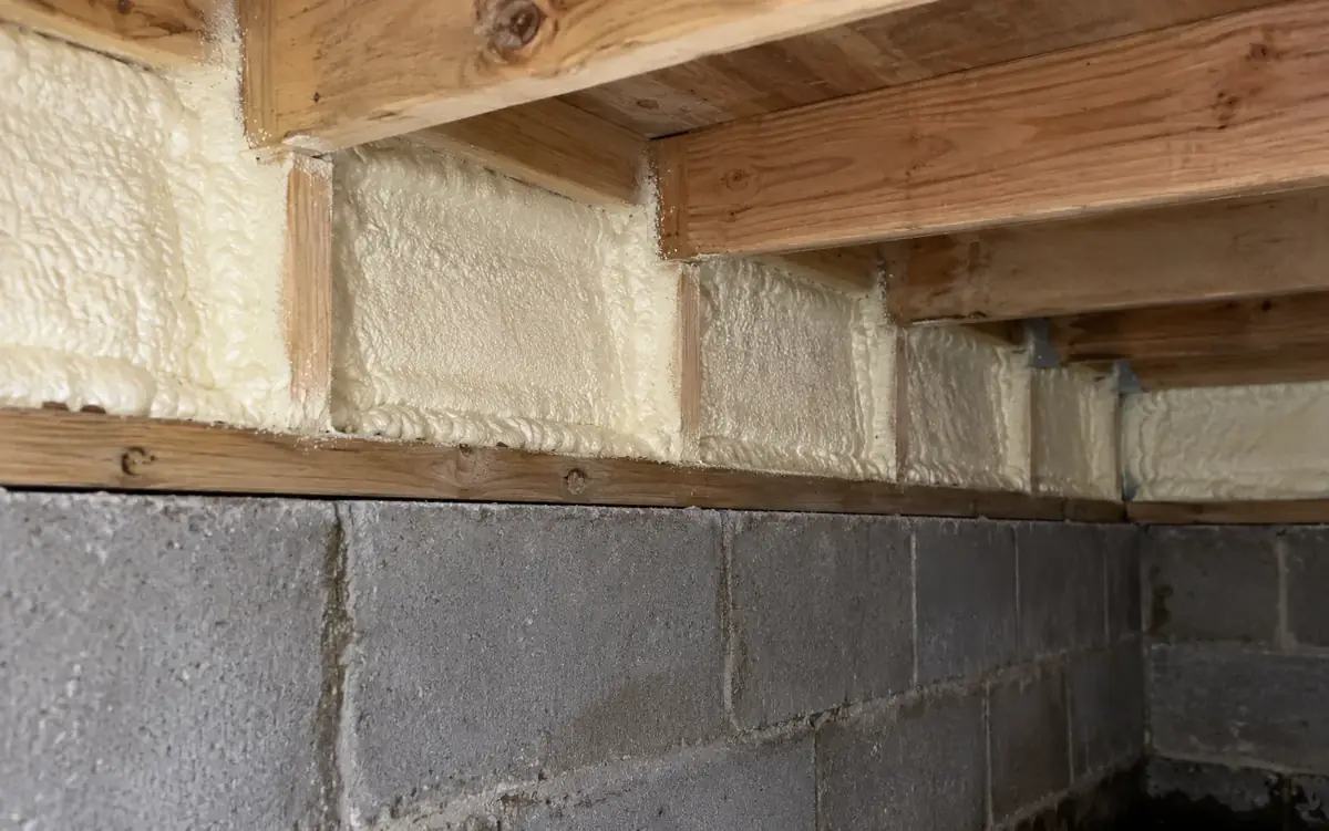 Closed-cell foam at the rim joist of an encapsulated crawl space