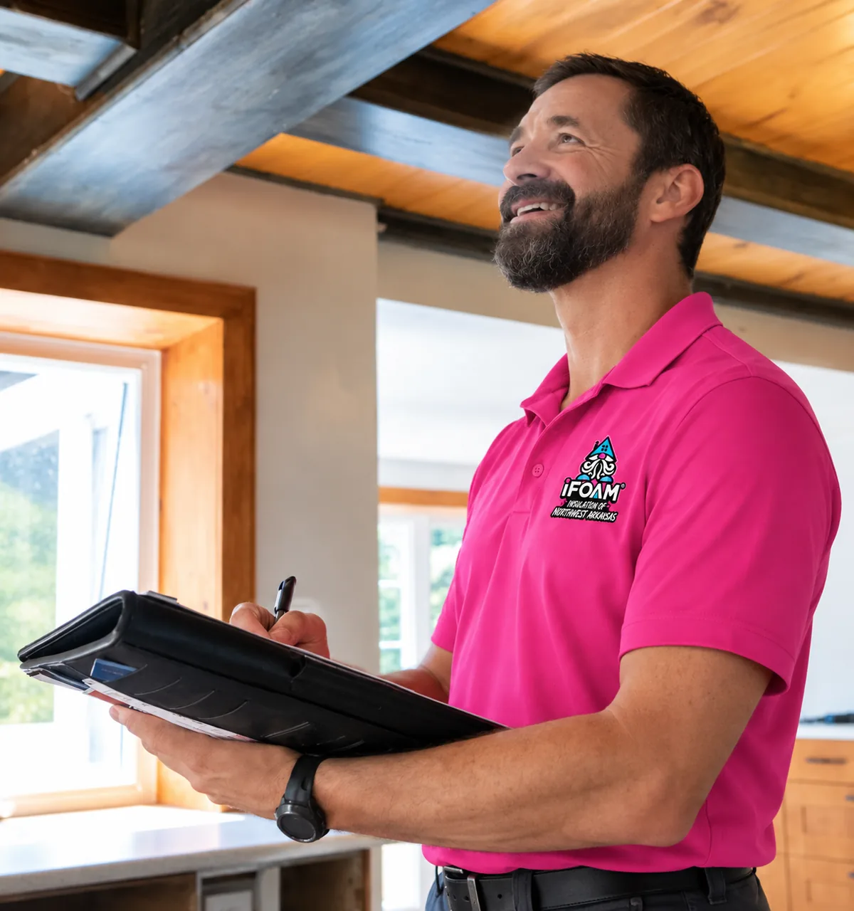 An iFOAM of Northwest Arkansas estimator writing up a quote on site